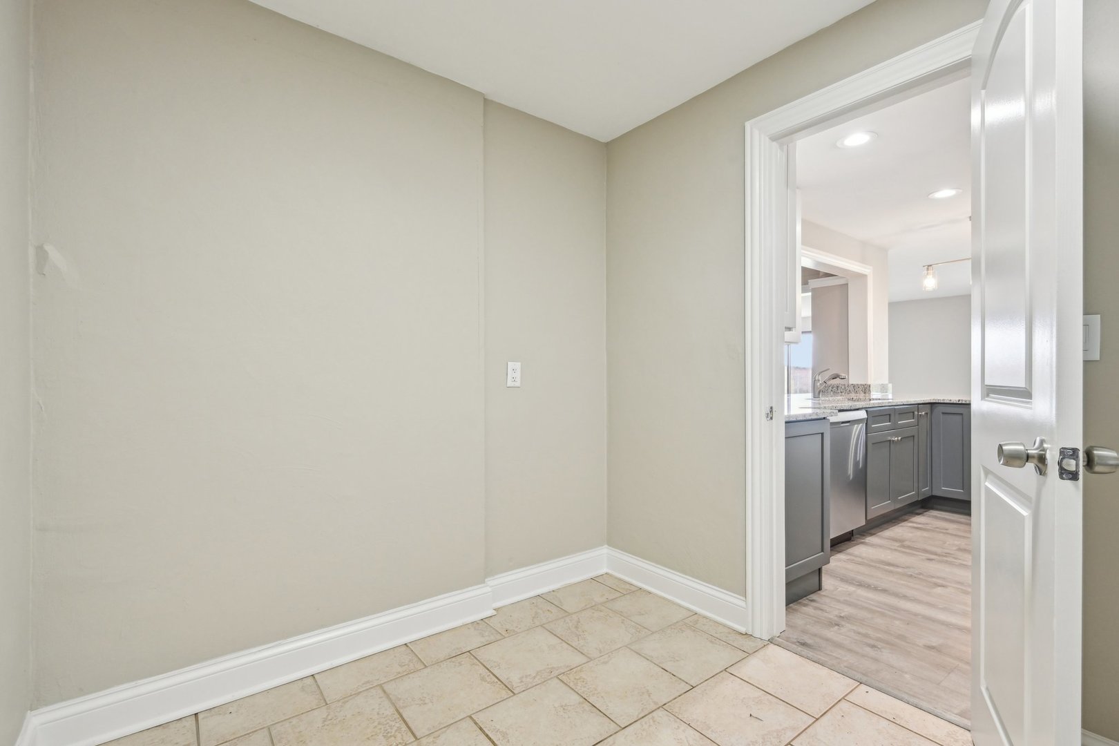 1406 Busse Road Marengo, IL 60152 - Photo 22 of 76 a view of a hallway with a sink and a refrigerator