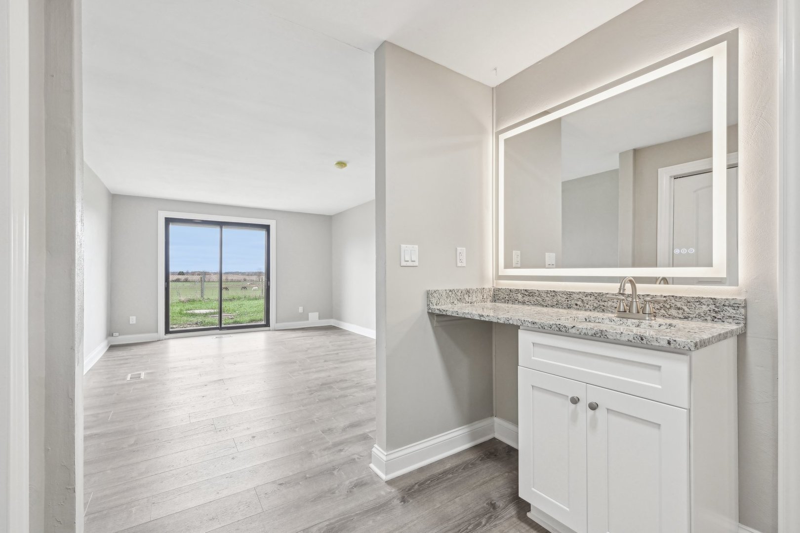 1406 Busse Road Marengo, IL 60152 - Photo 34 of 76 a bathroom with a granite countertop sink and a mirror
