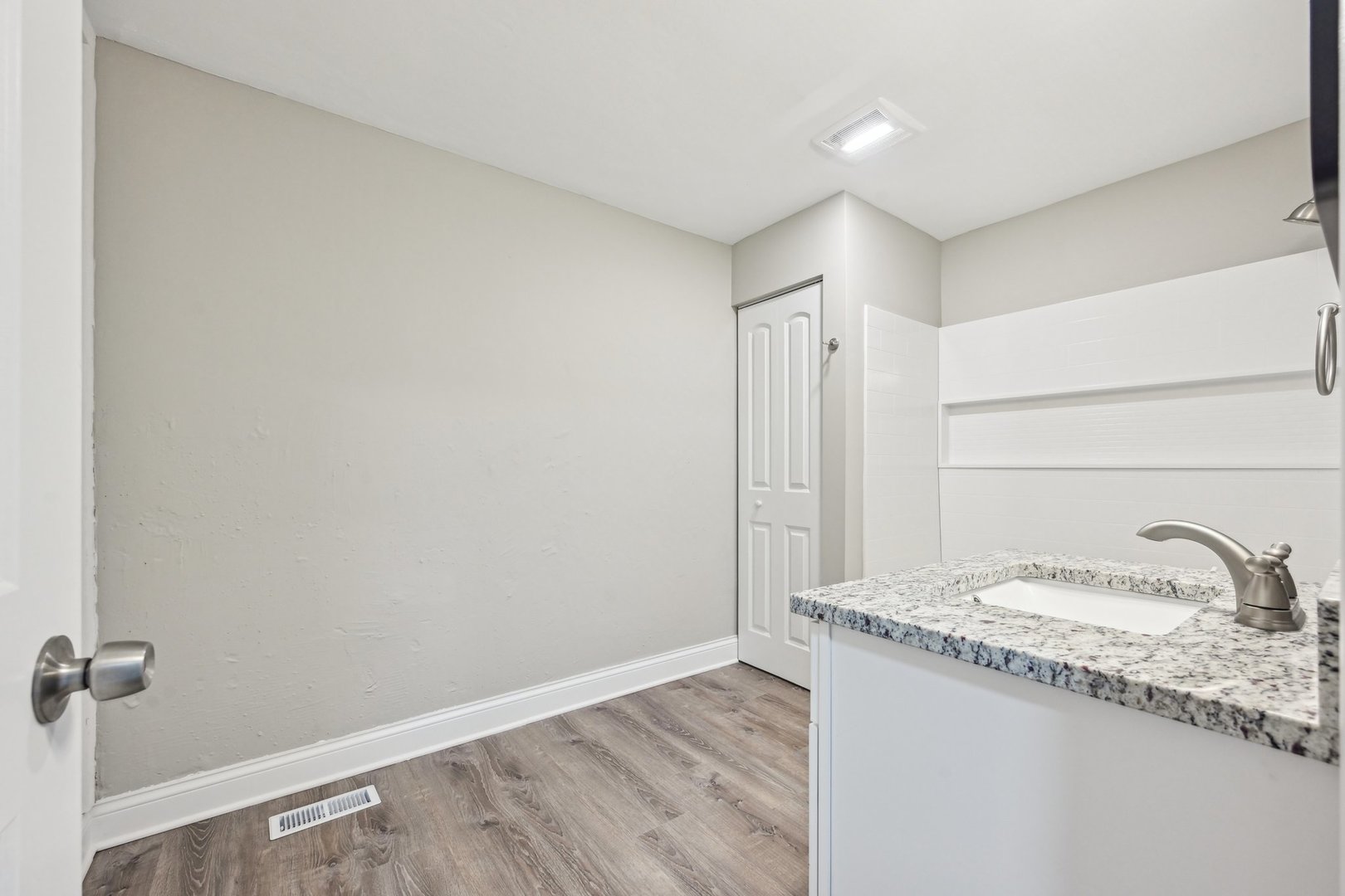 1406 Busse Road Marengo, IL 60152 - Photo 35 of 76 a bathroom with a granite countertop sink and a mirror