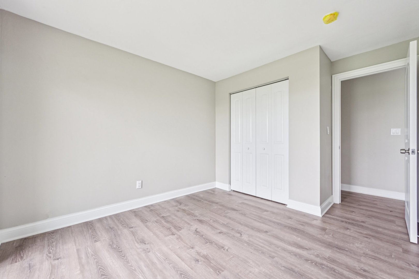 1406 Busse Road Marengo, IL 60152 - Photo 40 of 76 a view of an empty room with wooden floor and a window