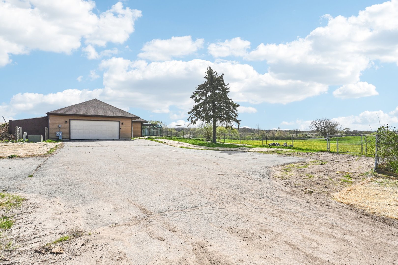 1406 Busse Road Marengo, IL 60152 - Photo 46 of 76 a view of a house with a yard and countertop