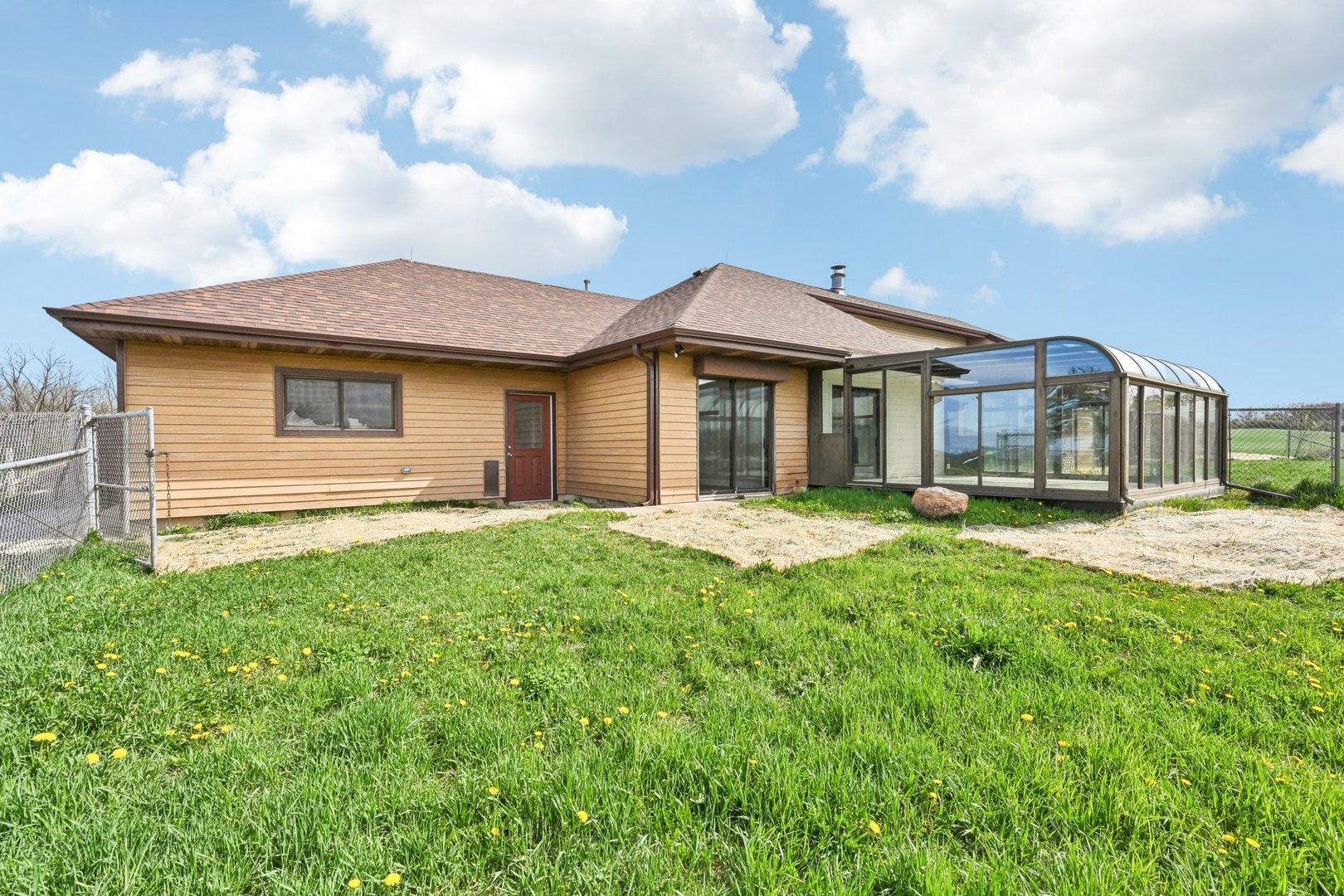 1406 Busse Road Marengo, IL 60152 - Photo 50 of 76 a front view of a house with a garden