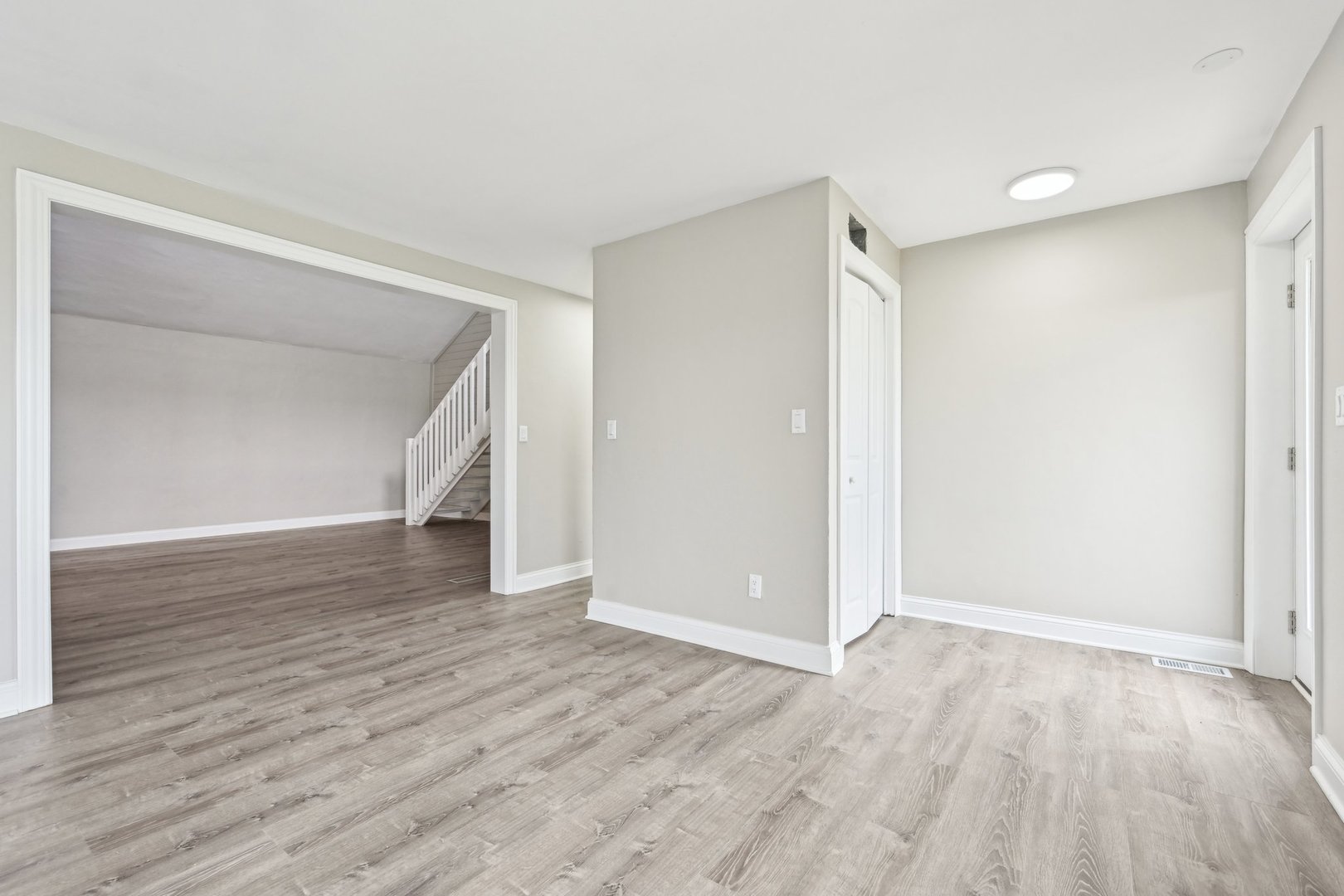 1406 Busse Road Marengo, IL 60152 - Photo 6 of 76 a view of an empty room with wooden floor and closet