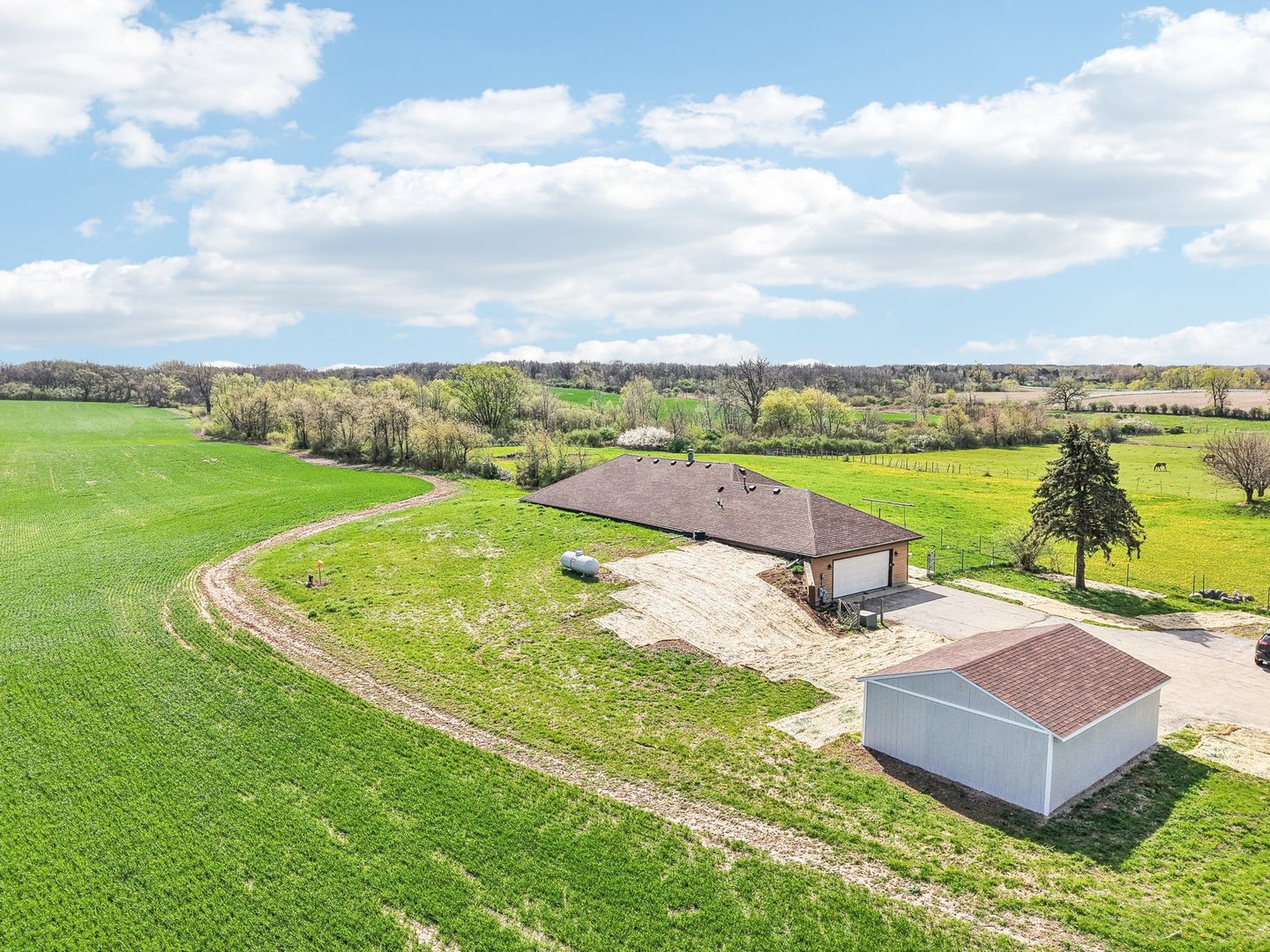 1406 Busse Road Marengo, IL 60152 - Photo 62 of 76 a view of a lake with a yard and lake view
