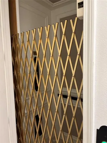 a close up view of a white door and a shower curtain