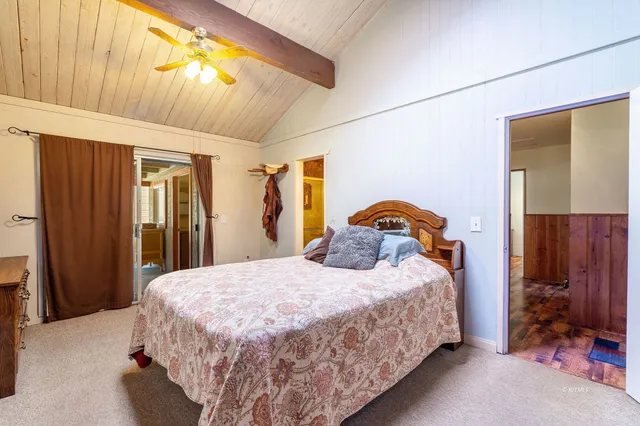 a bathroom with a sink a toilet and shower curtain