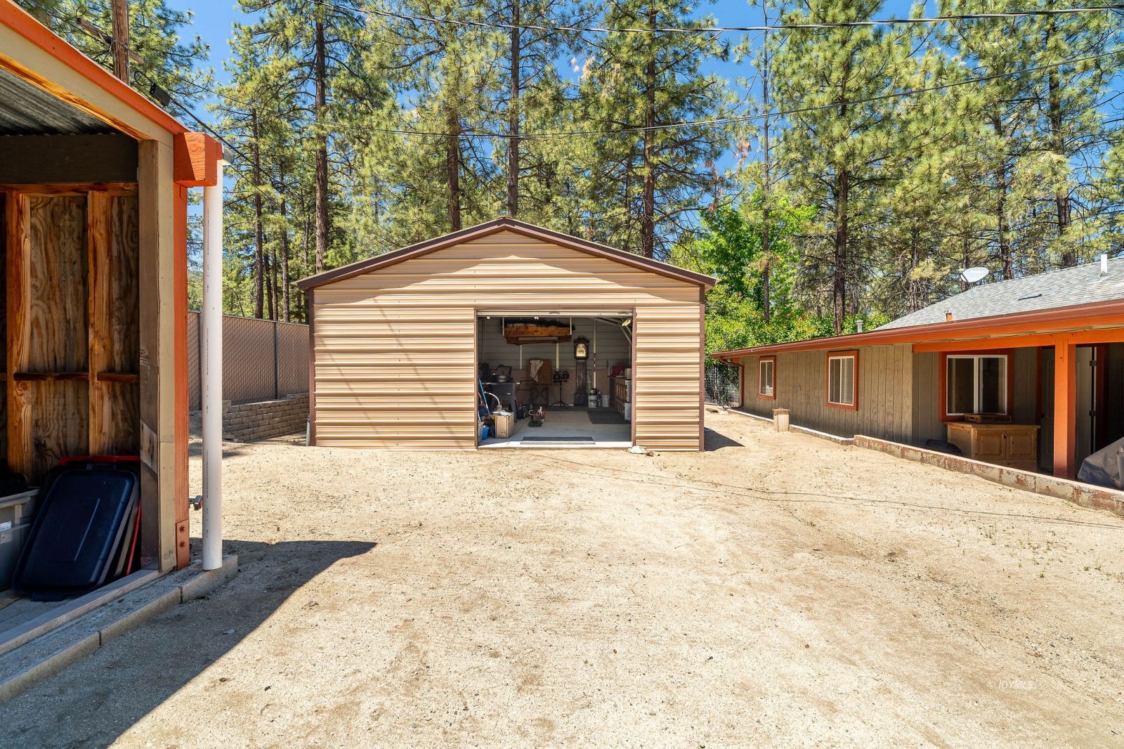 59341 Courtesy Drive Mountain Center, CA 92561 - Photo 36 of 49 a front view of a house with a yard and garage