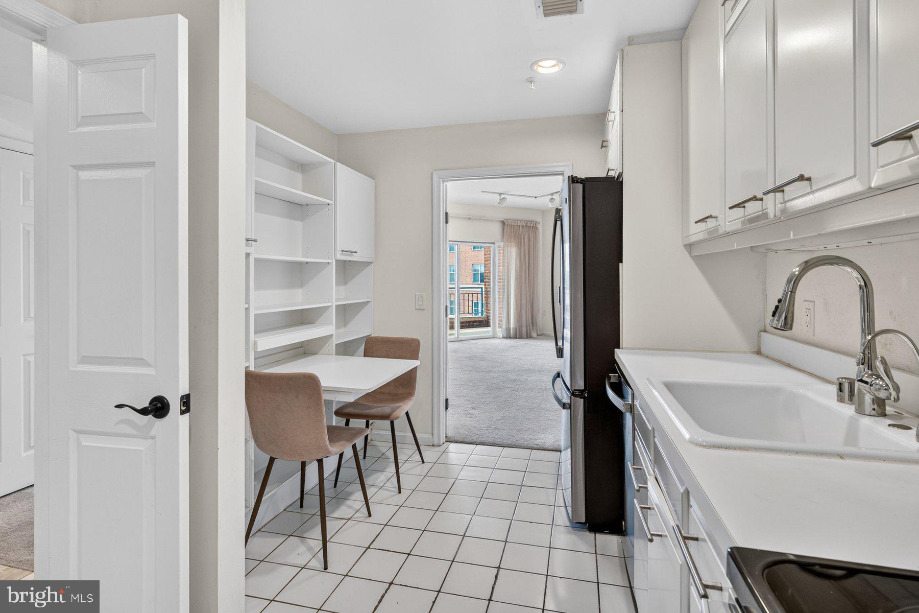 3801 Canterbury Road, Unit 403 Baltimore, MD 21218 - Photo 5 of 25 Bright and airy kitchen space.