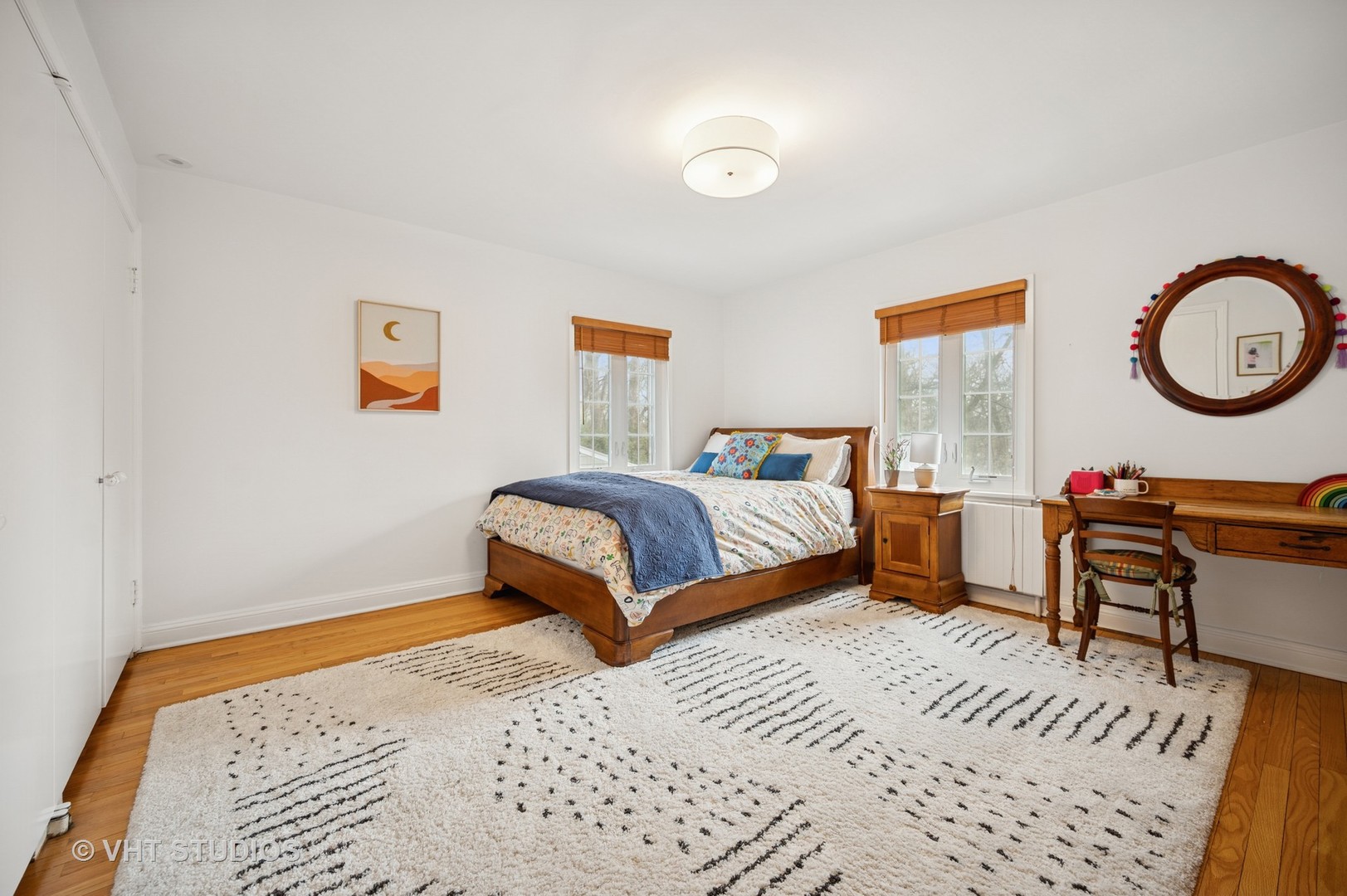 1413 Tower Road Winnetka, IL 60093 - Photo 18 of 32 a bedroom with a bed a table and a potted plant