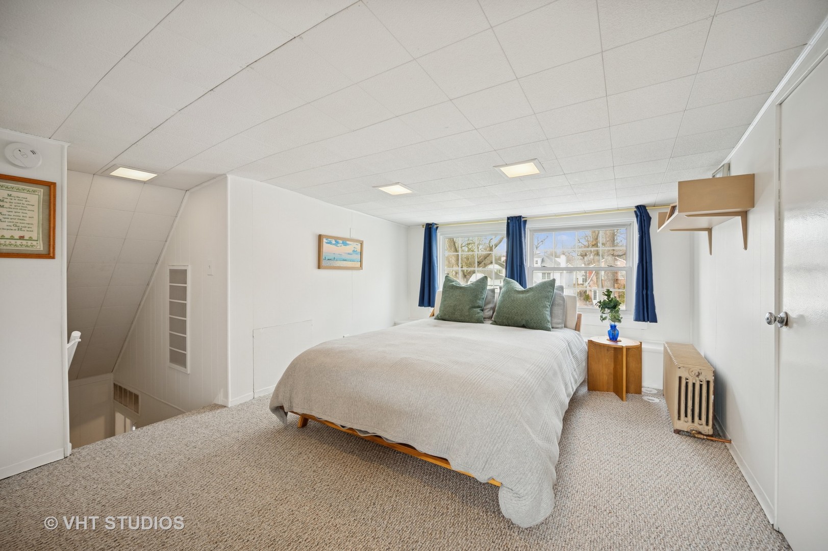 1413 Tower Road Winnetka, IL 60093 - Photo 21 of 32 a bedroom with a large bed and a chandelier
