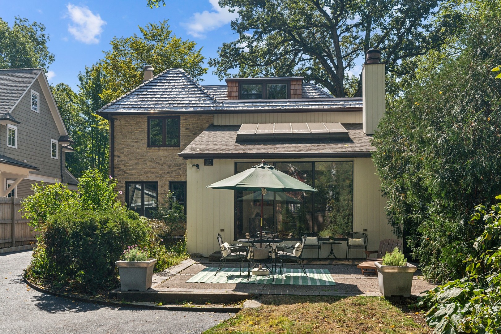 1413 Tower Road Winnetka, IL 60093 - Photo 27 of 32 a front view of a house with garden