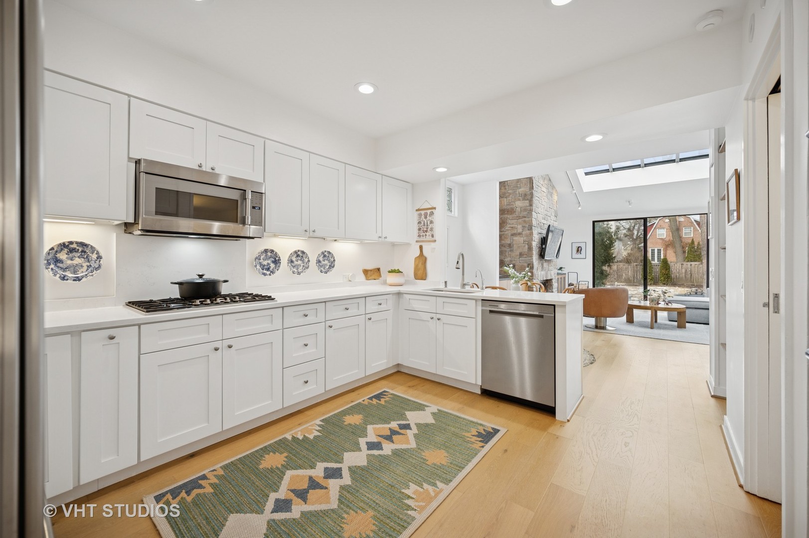 1413 Tower Road Winnetka, IL 60093 - Photo 7 of 32 a kitchen with granite countertop a sink cabinets and stainless steel appliances