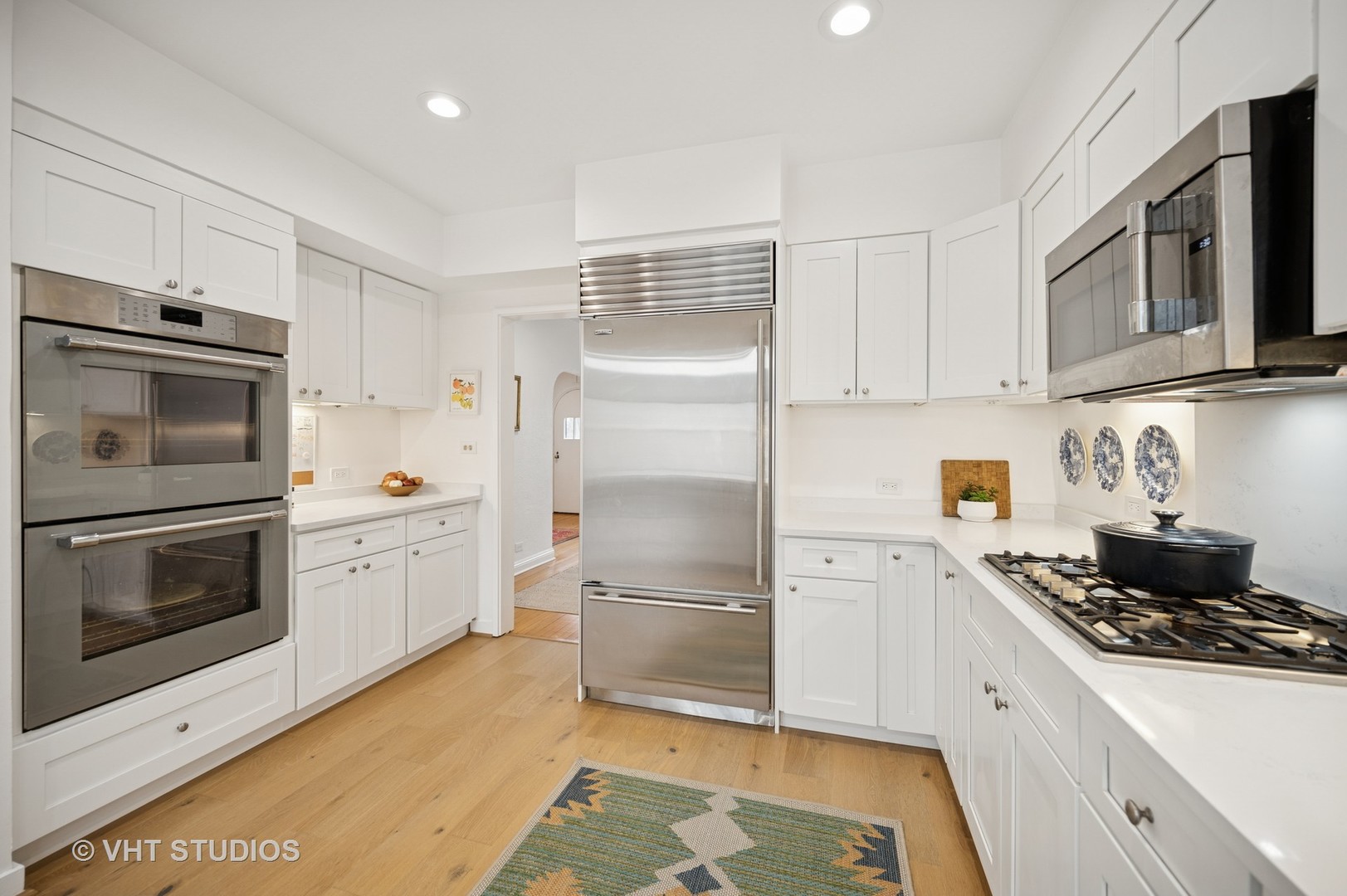 1413 Tower Road Winnetka, IL 60093 - Photo 9 of 32 a kitchen with a refrigerator stove and microwave