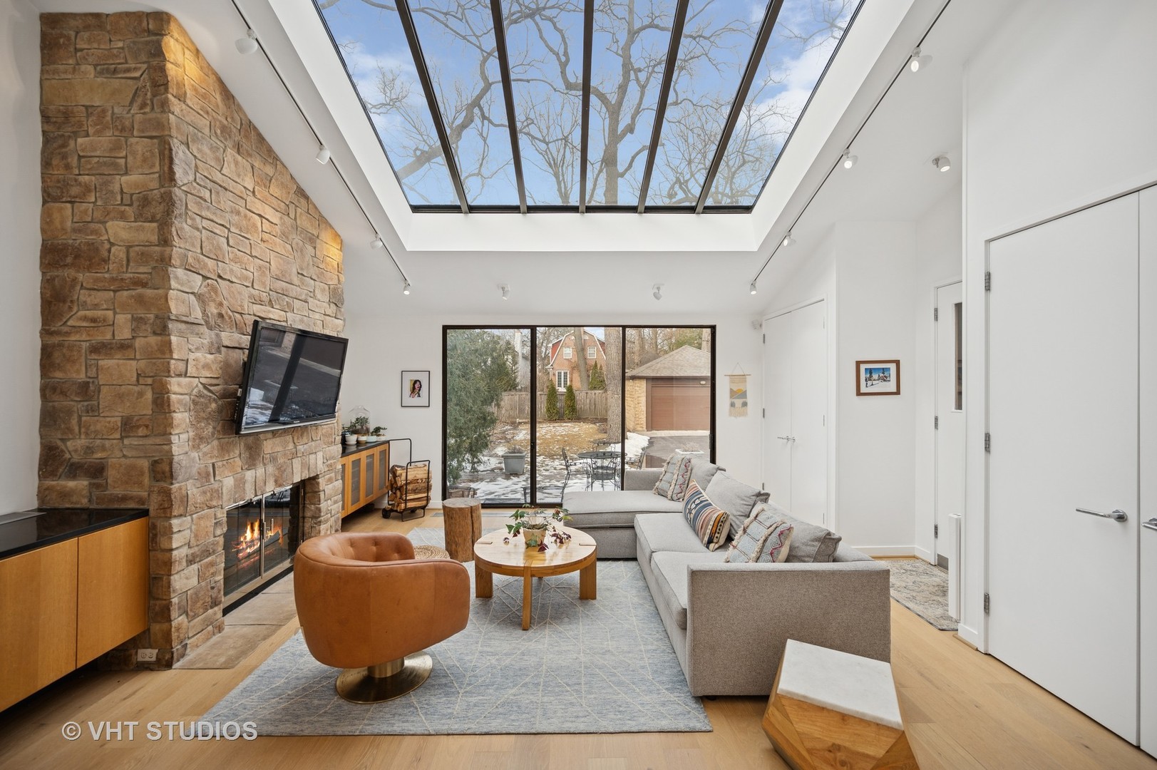 1413 Tower Road Winnetka, IL 60093 - Photo 10 of 32 a living room with furniture and a flat screen tv