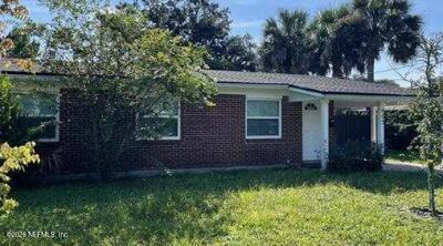 435 Whiting Lane Atlantic Beach, FL 32233 - Photo 1 of 1 a view of a house with garden and plants