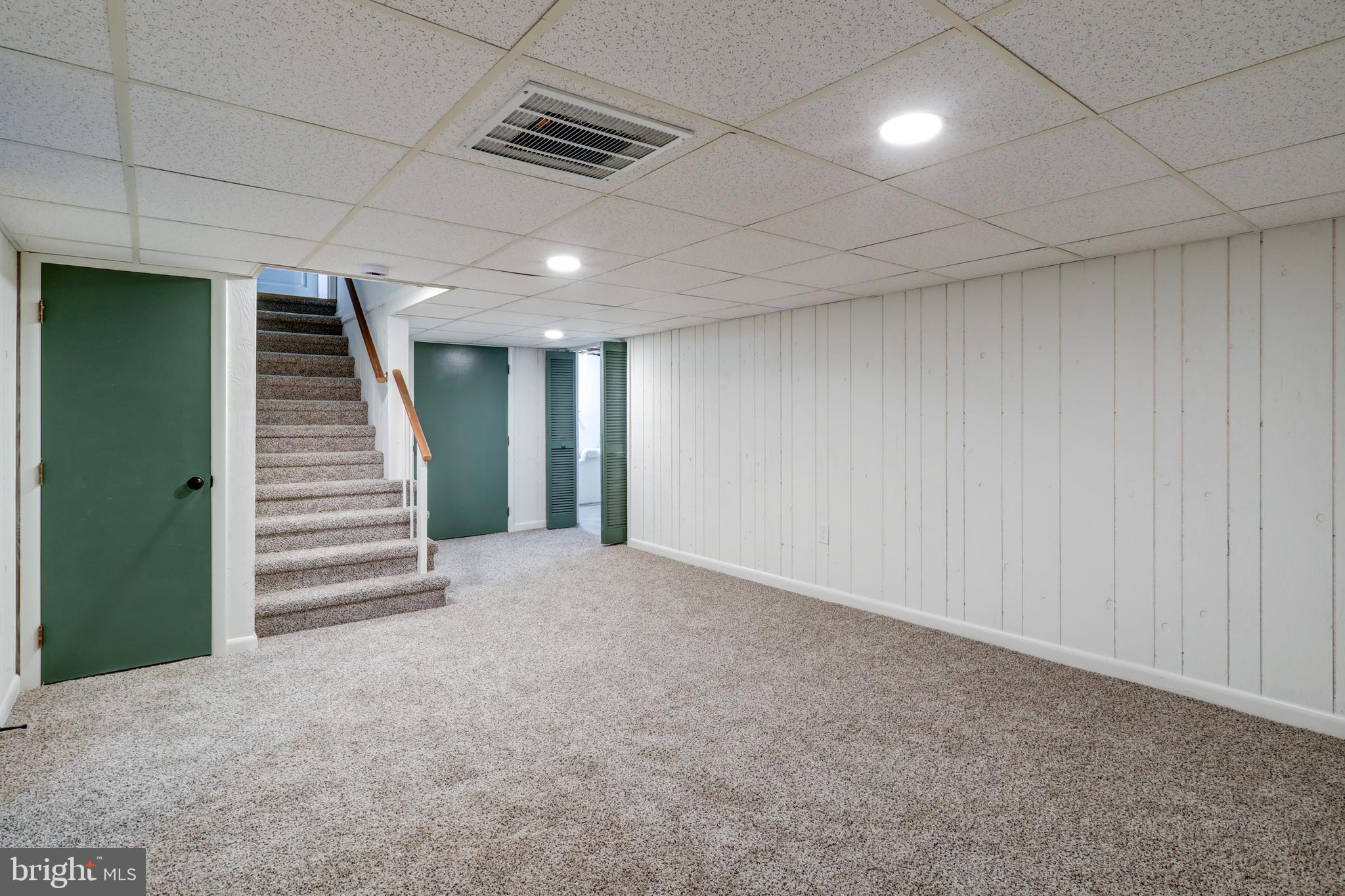 421 Edgehill Road York, PA 17403 - Photo 27 of 44 an empty room with a stairs and a ceiling fan