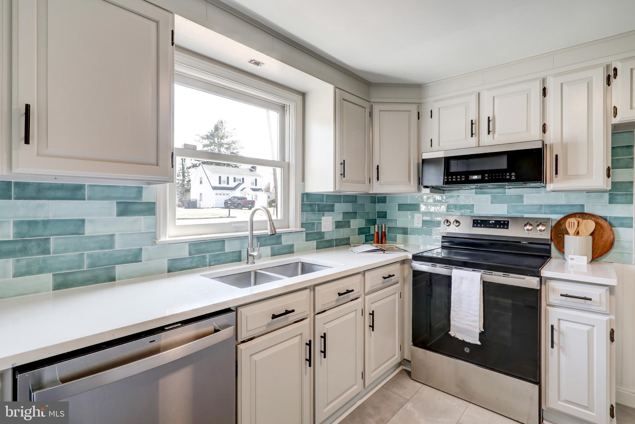 421 Edgehill Road York, PA 17403 - Photo 8 of 44 a kitchen with appliances cabinets and a sink