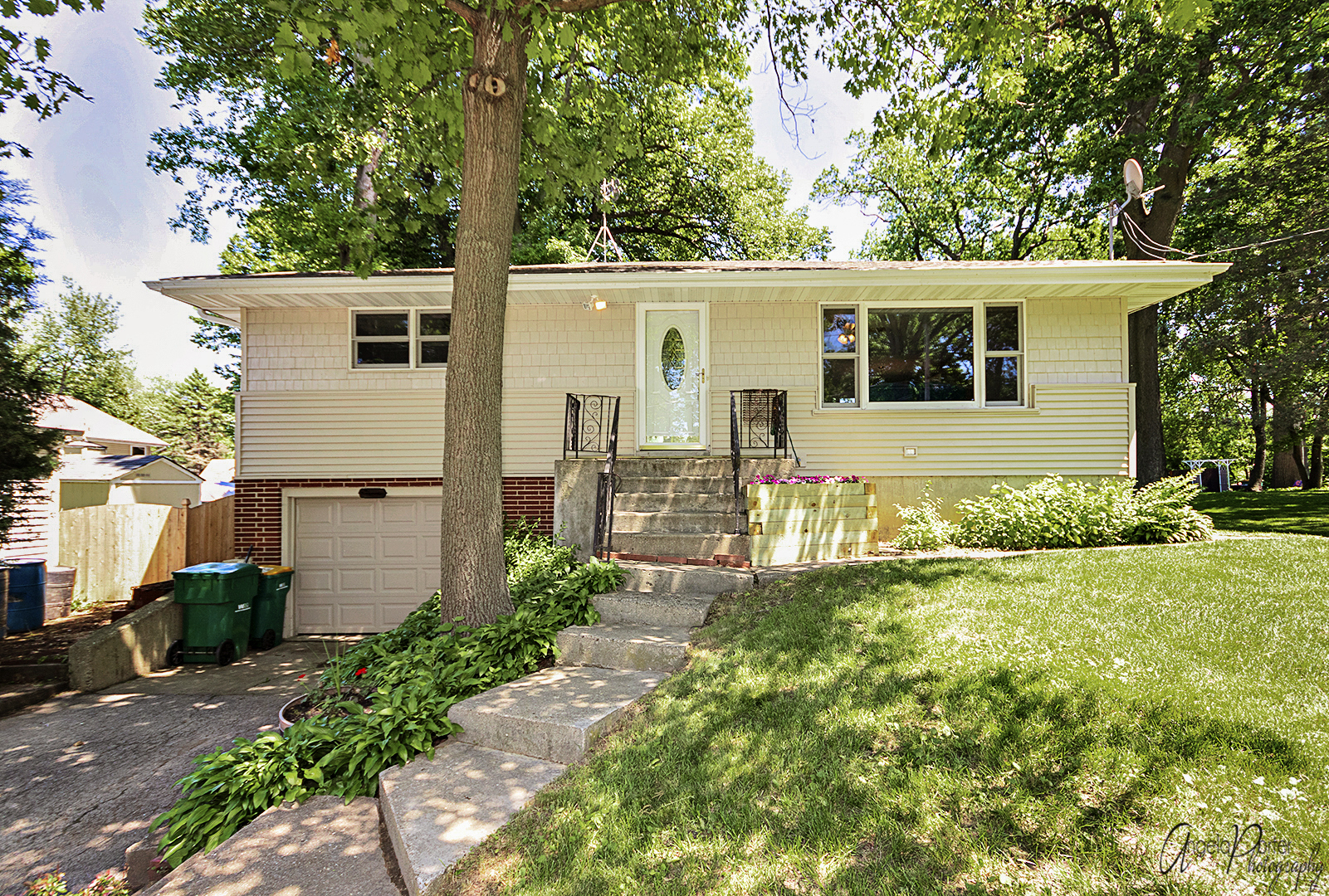 135 Eagle Point Road Fox Lake, IL 60020 - Photo 1 of 27 a front view of house with yard and trees in the background