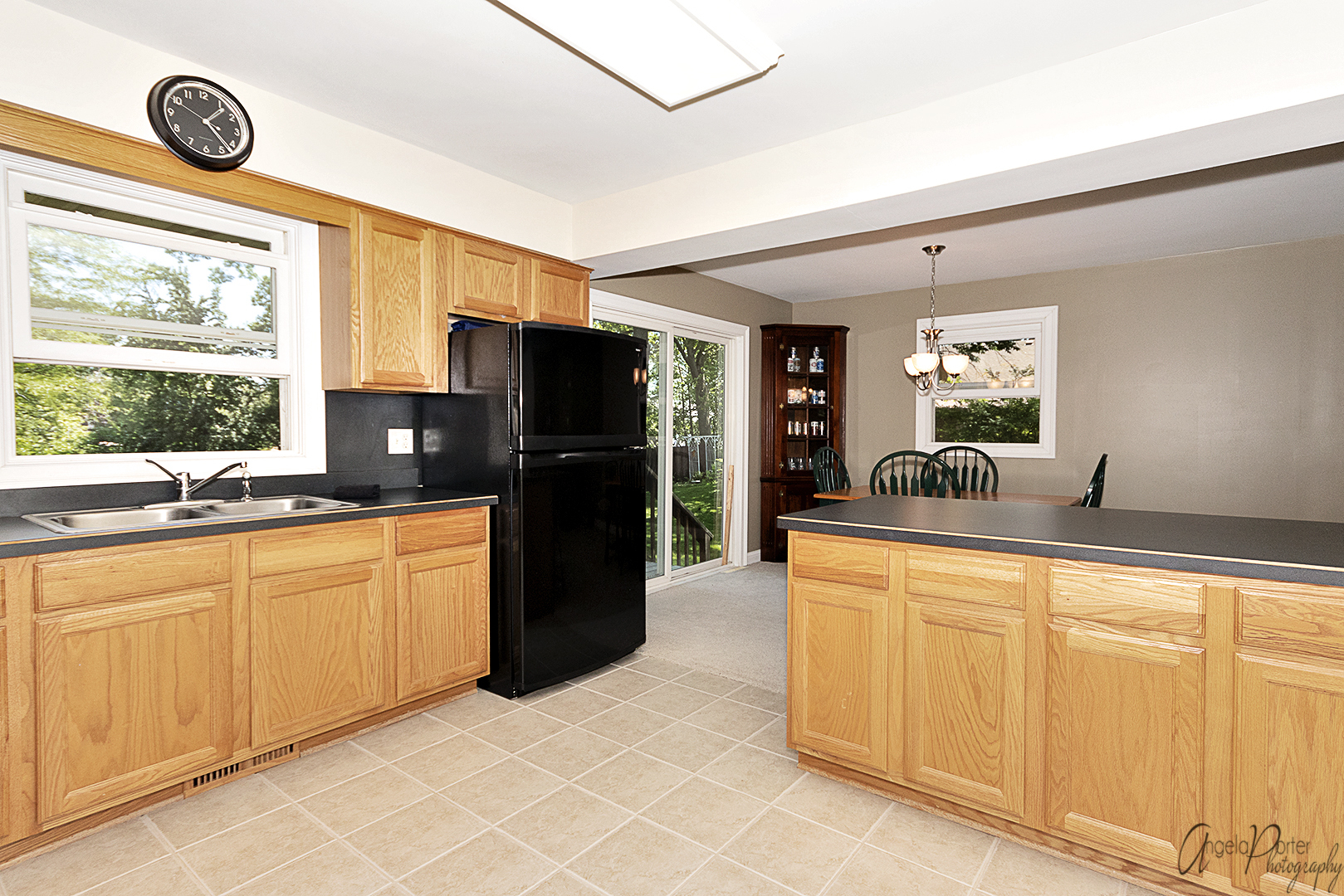 135 Eagle Point Road Fox Lake, IL 60020 - Photo 11 of 27 a large kitchen with stainless steel appliances a large window a refrigerator and a sink