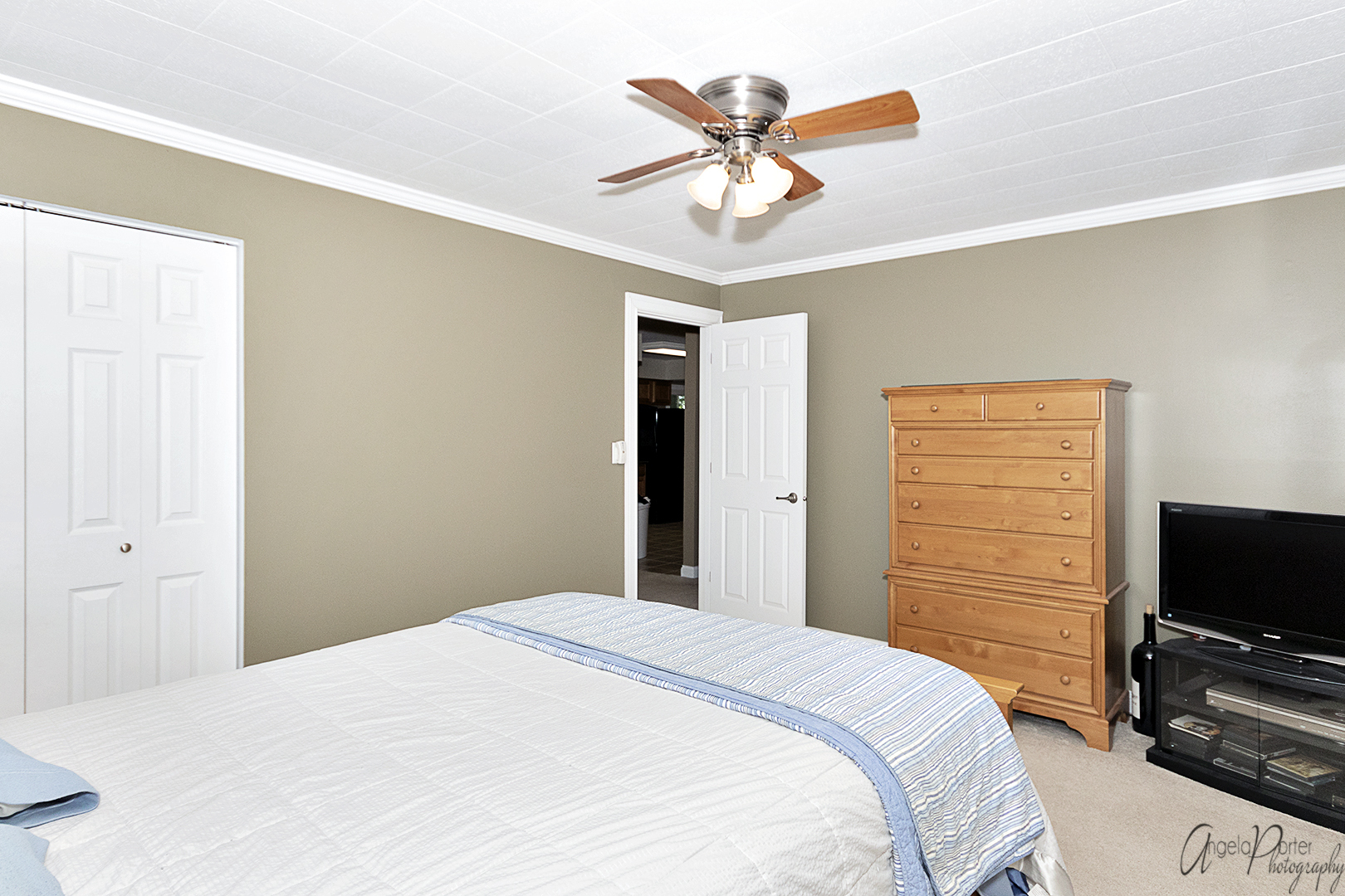 135 Eagle Point Road Fox Lake, IL 60020 - Photo 15 of 27 a bedroom with a bed and a flat screen tv