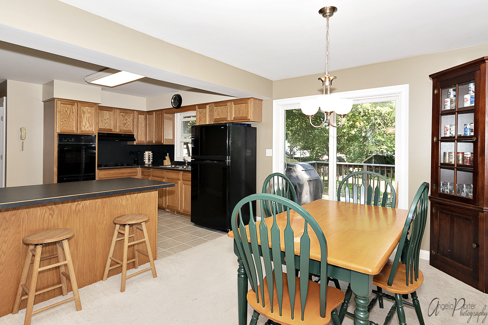 135 Eagle Point Road Fox Lake, IL 60020 - Photo 7 of 27 a kitchen with stainless steel appliances granite countertop a stove a refrigerator a oven a sink with a dining table and chairs