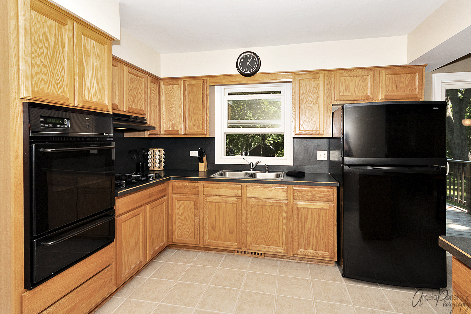 135 Eagle Point Road Fox Lake, IL 60020 - Photo 10 of 27 a kitchen with granite countertop a refrigerator and a sink