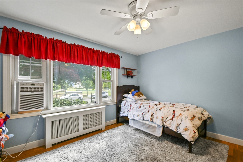 293 Harrington Way Worcester, MA 01604 - Photo 18 of 29 a bedroom with a bed and a window