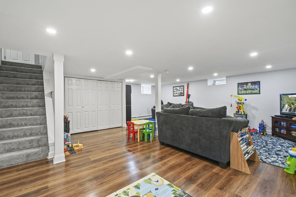 293 Harrington Way Worcester, MA 01604 - Photo 19 of 29 a living room with furniture and a wooden floor