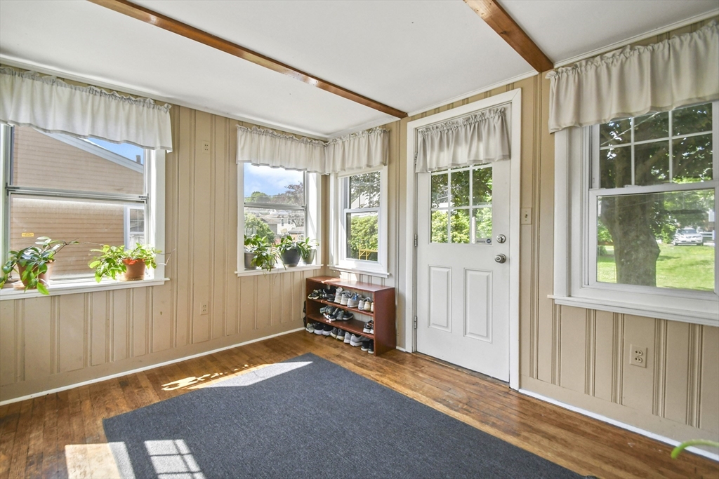 293 Harrington Way Worcester, MA 01604 - Photo 2 of 29 a room with window and a wooden floor