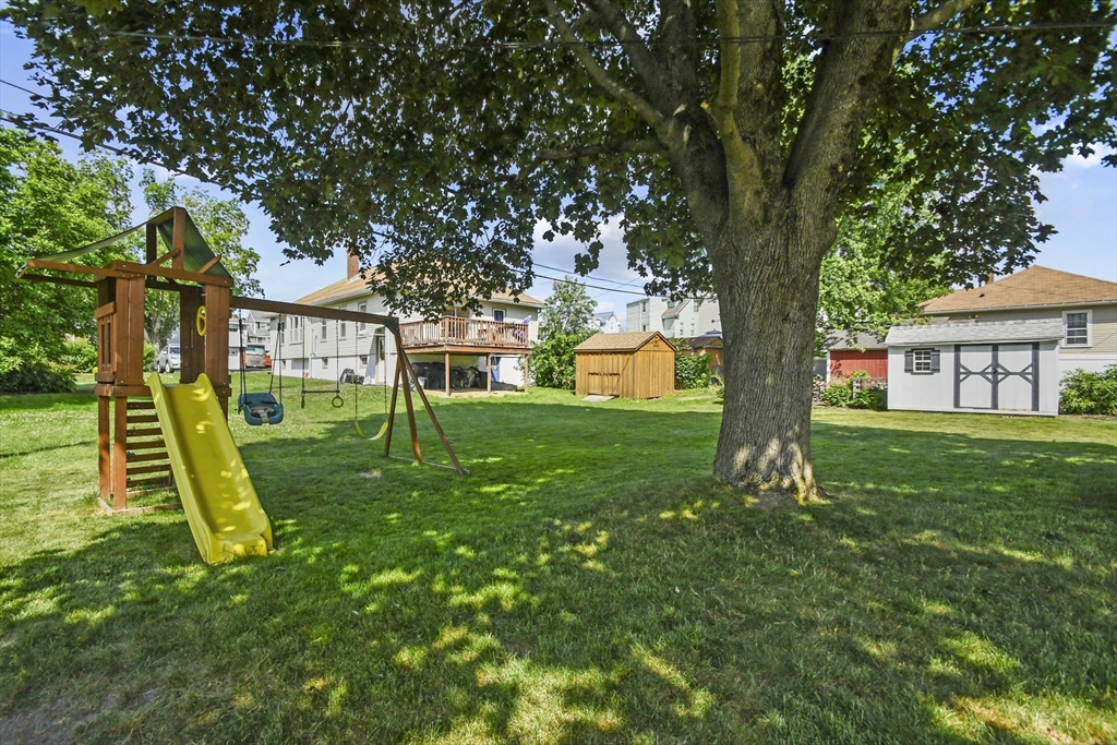 293 Harrington Way Worcester, MA 01604 - Photo 21 of 29 a view of a house with a yard