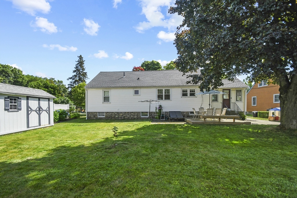 293 Harrington Way Worcester, MA 01604 - Photo 23 of 29 a front view of a house with a garden