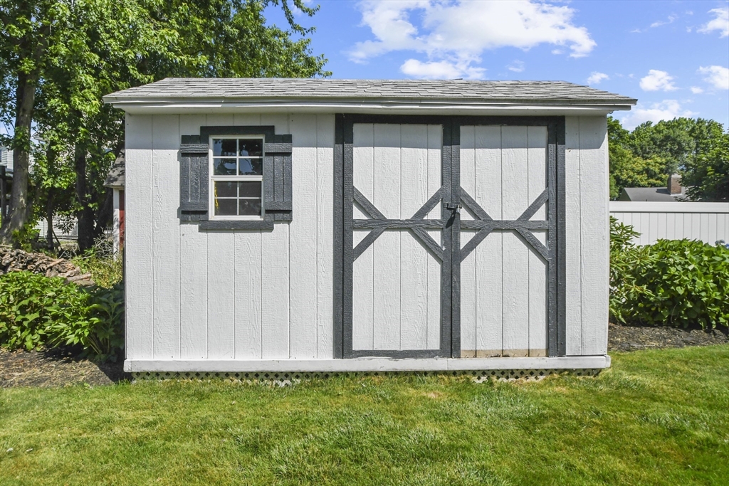 293 Harrington Way Worcester, MA 01604 - Photo 29 of 29 a front view of a house with garden
