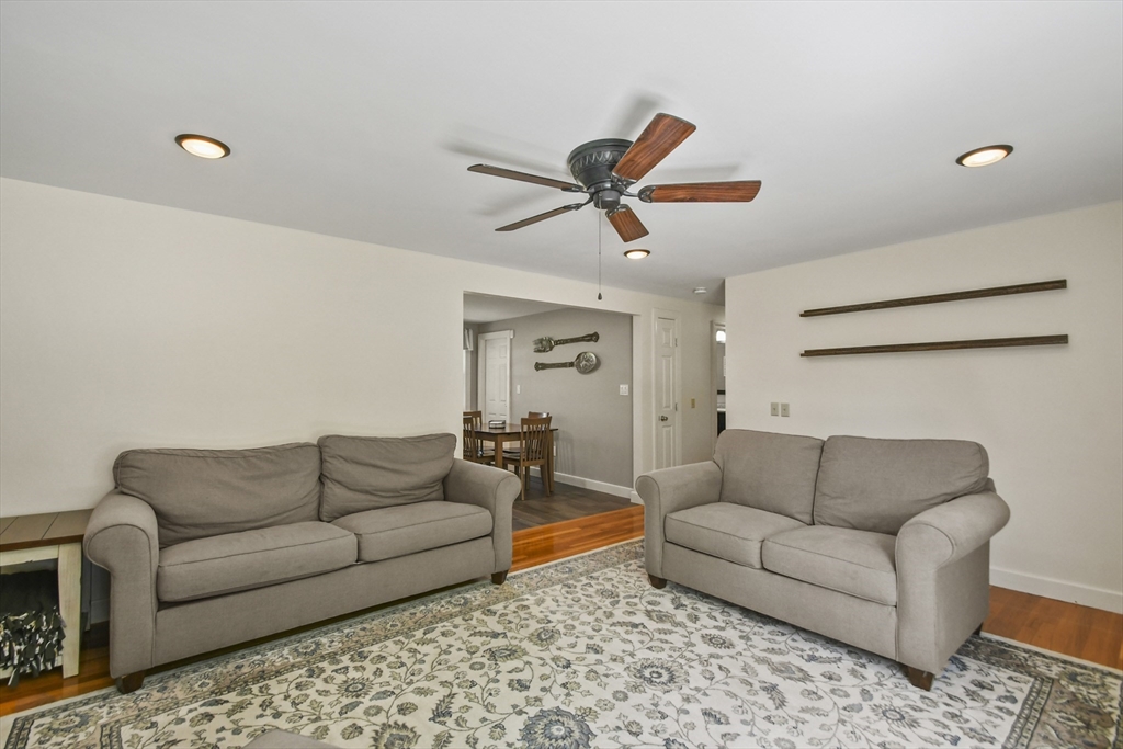 293 Harrington Way Worcester, MA 01604 - Photo 4 of 29 a living room with furniture and a ceiling fan