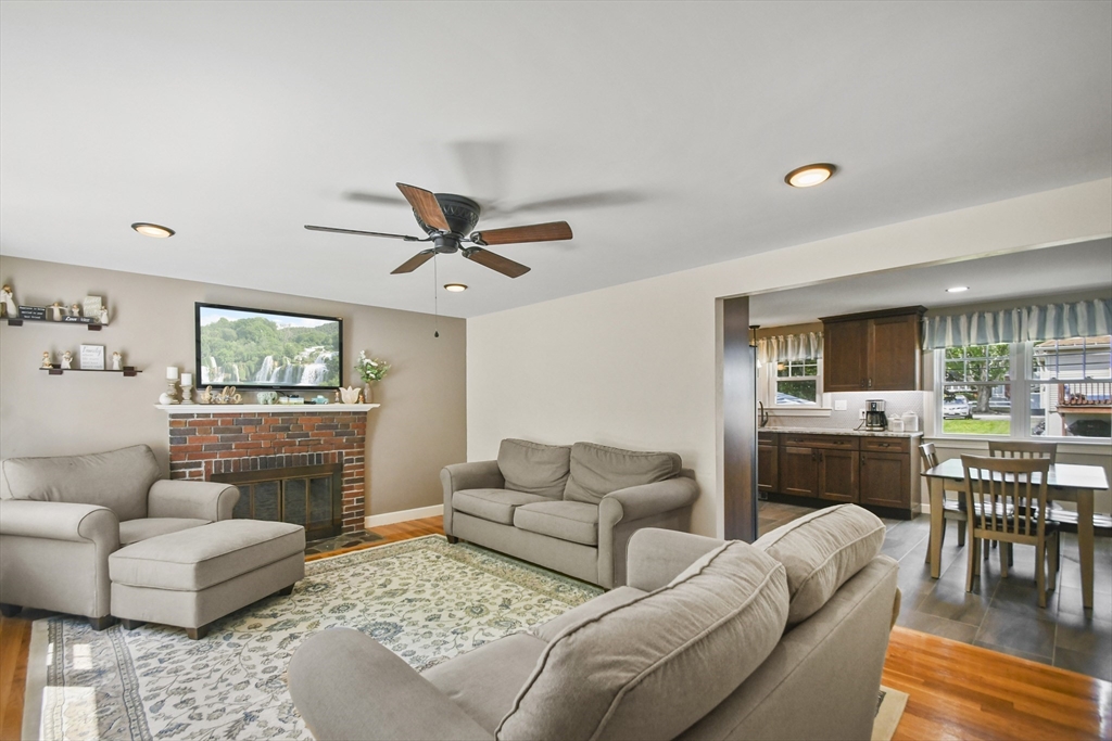 293 Harrington Way Worcester, MA 01604 - Photo 5 of 29 a living room with furniture and a flat screen tv