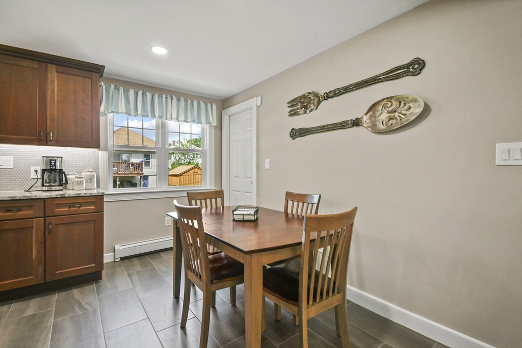 293 Harrington Way Worcester, MA 01604 - Photo 9 of 29 a kitchen with a table and chairs in it