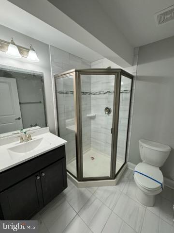 1095 Llano Drive La Plata, MD 20646 - Photo 18 of 19 a bathroom with a double vanity sink toilet and shower