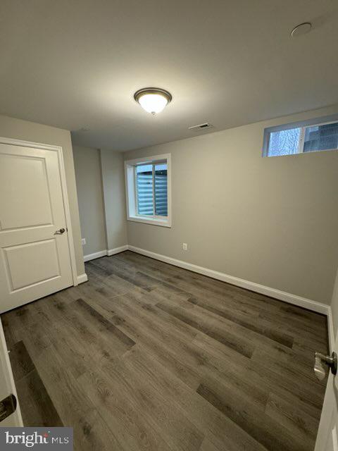 1095 Llano Drive La Plata, MD 20646 - Photo 19 of 19 an empty room with wooden floor and windows