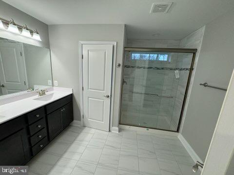 1095 Llano Drive La Plata, MD 20646 - Photo 6 of 19 a spacious bathroom with a mirror sink and shower