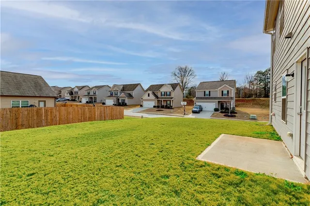 a backyard of a house with lots of green space