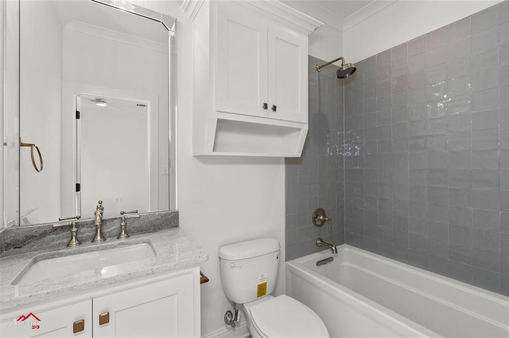 35 Turtle Creek Drive Benton, LA 71006 - Photo 30 of 32 a bathroom with a granite countertop sink a toilet and bathtub