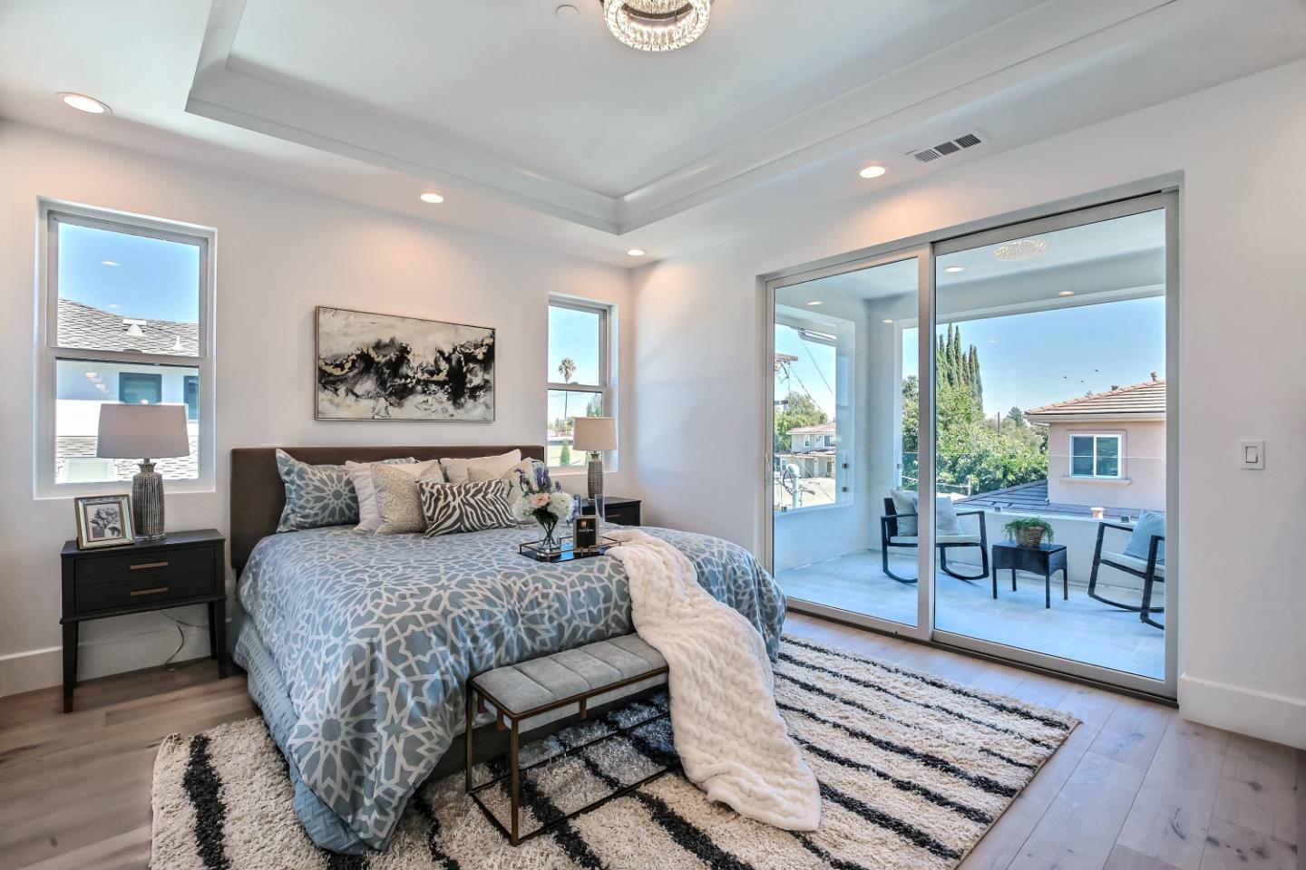 10732 Culbertson Drive Cupertino, CA 95014 - Photo 14 of 36 a bedroom with a bed and wooden floor