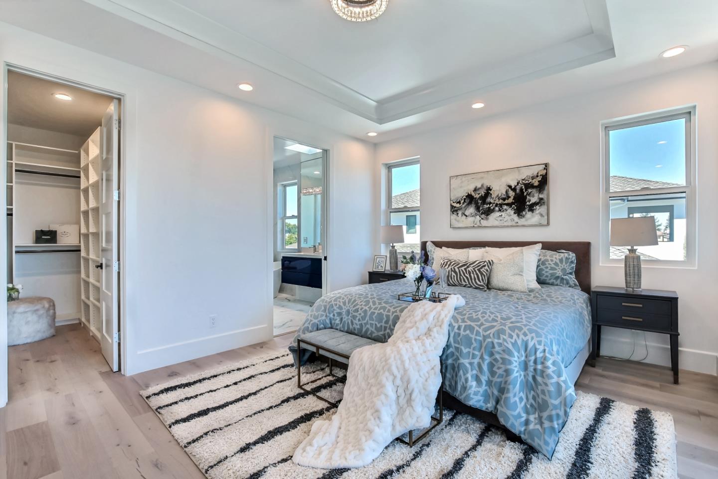 10732 Culbertson Drive Cupertino, CA 95014 - Photo 15 of 36 a bedroom with a large bed and a painting on the wall