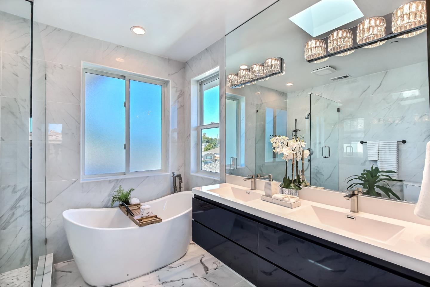 10732 Culbertson Drive Cupertino, CA 95014 - Photo 18 of 36 a bathroom with a bathtub a sink and a mirror