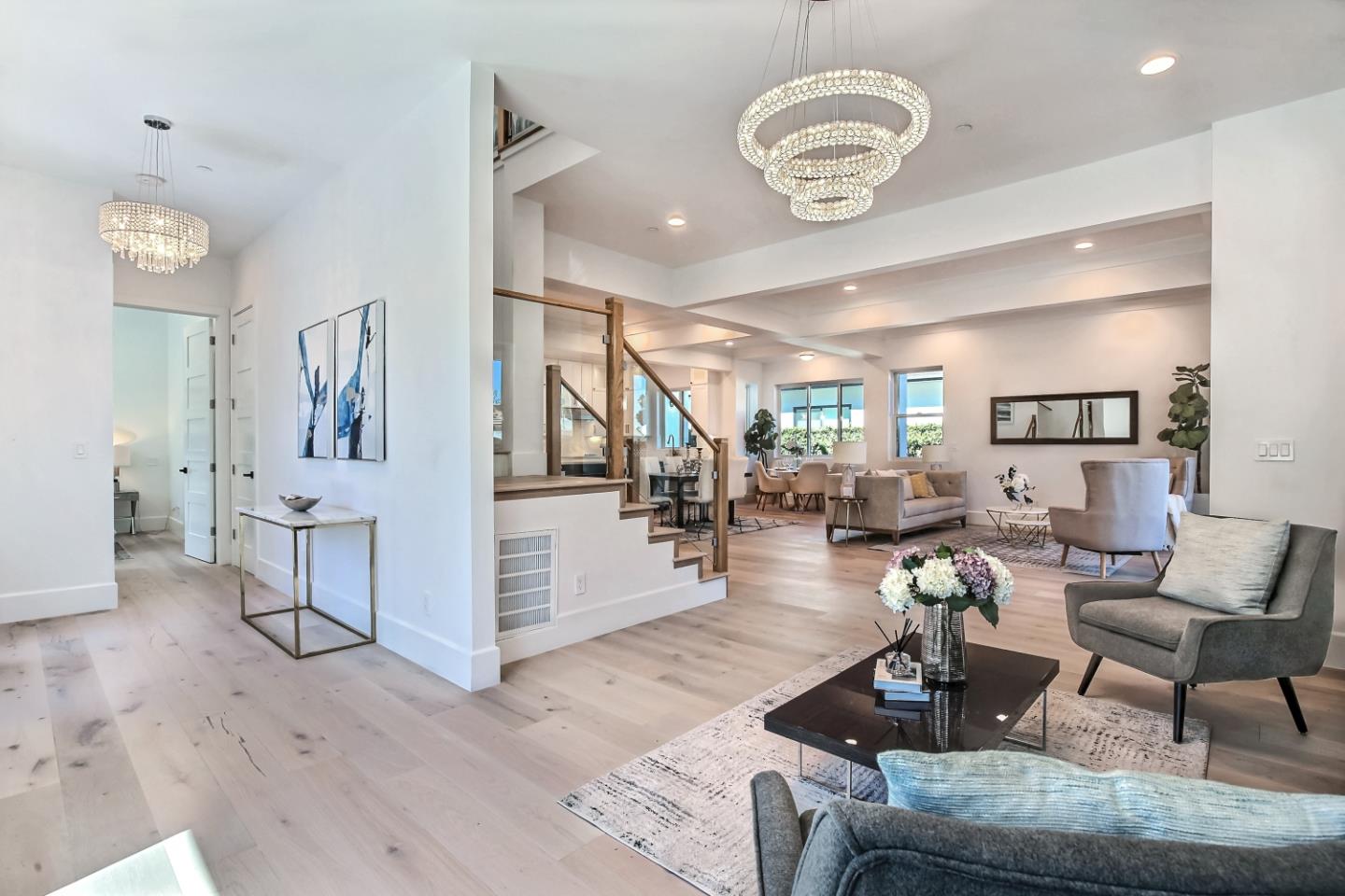 10732 Culbertson Drive Cupertino, CA 95014 - Photo 2 of 36 a living room with furniture and a chandelier