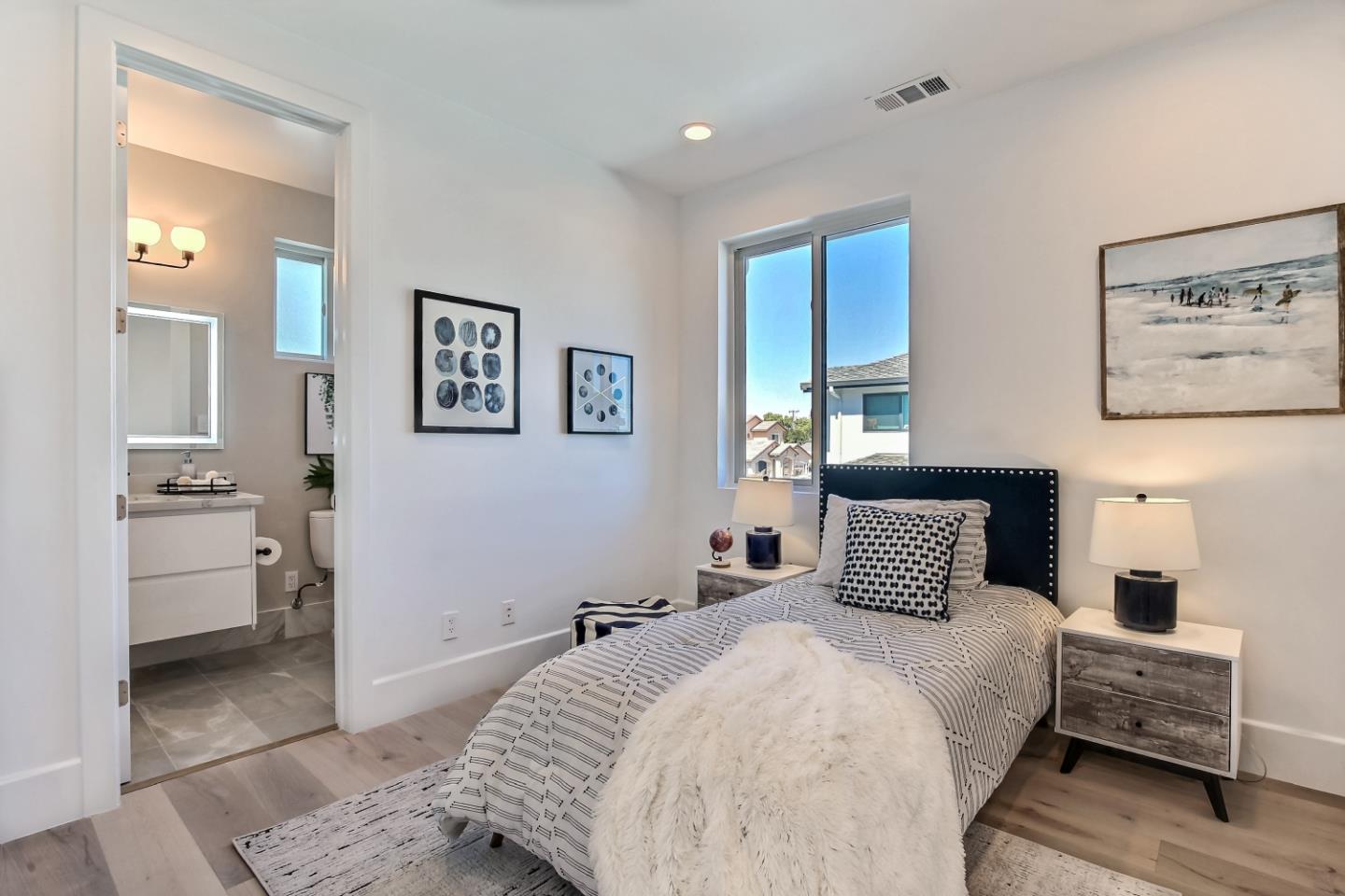 10732 Culbertson Drive Cupertino, CA 95014 - Photo 21 of 36 a bedroom with a large bed and furniture