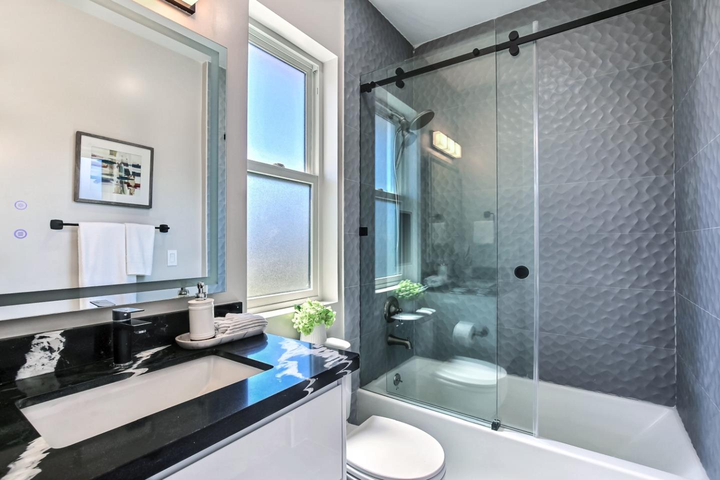10732 Culbertson Drive Cupertino, CA 95014 - Photo 22 of 36 a bathroom with a sink double vanity and a bathtub