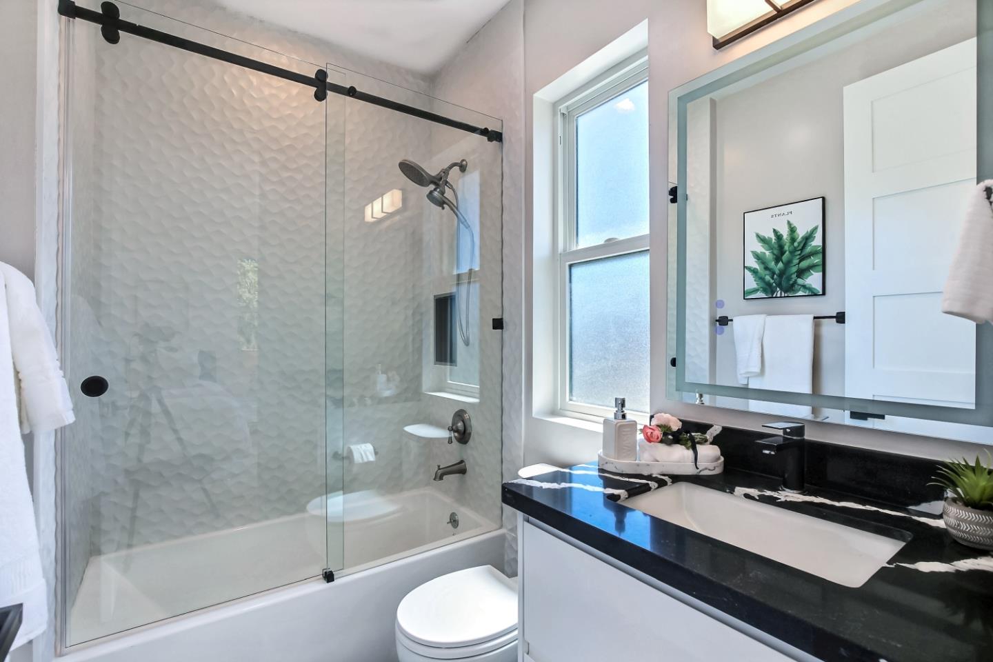 10732 Culbertson Drive Cupertino, CA 95014 - Photo 24 of 36 a bathroom with a granite countertop sink mirror toilet and bathtub