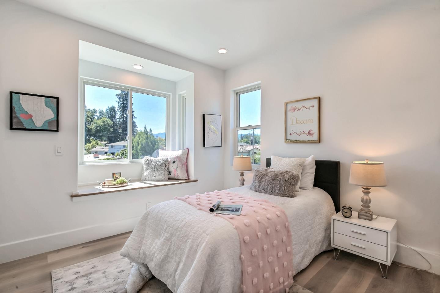 10732 Culbertson Drive Cupertino, CA 95014 - Photo 25 of 36 a bedroom with a bed and a large window
