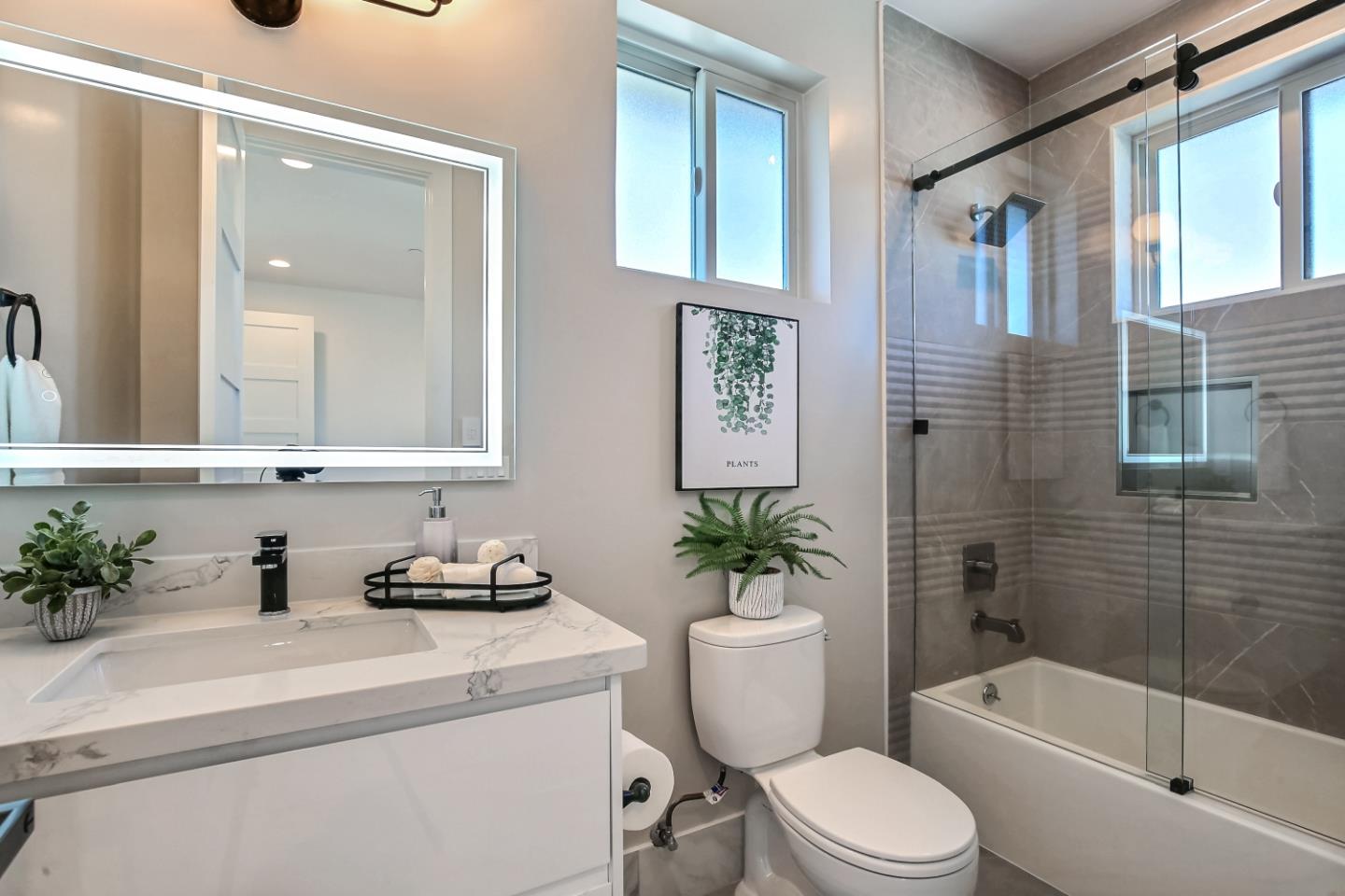 10732 Culbertson Drive Cupertino, CA 95014 - Photo 26 of 36 a bathroom with a sink a toilet a mirror and shower