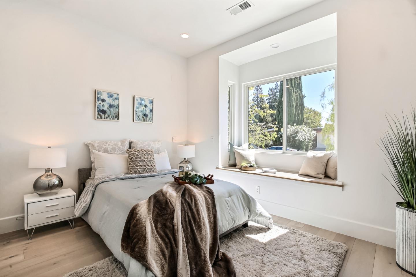 10732 Culbertson Drive Cupertino, CA 95014 - Photo 35 of 36 a bed room with a bed and a large window